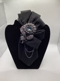Midnight Elegance Statement Tie – Black Crystal Floral Brooch with Chain Accent