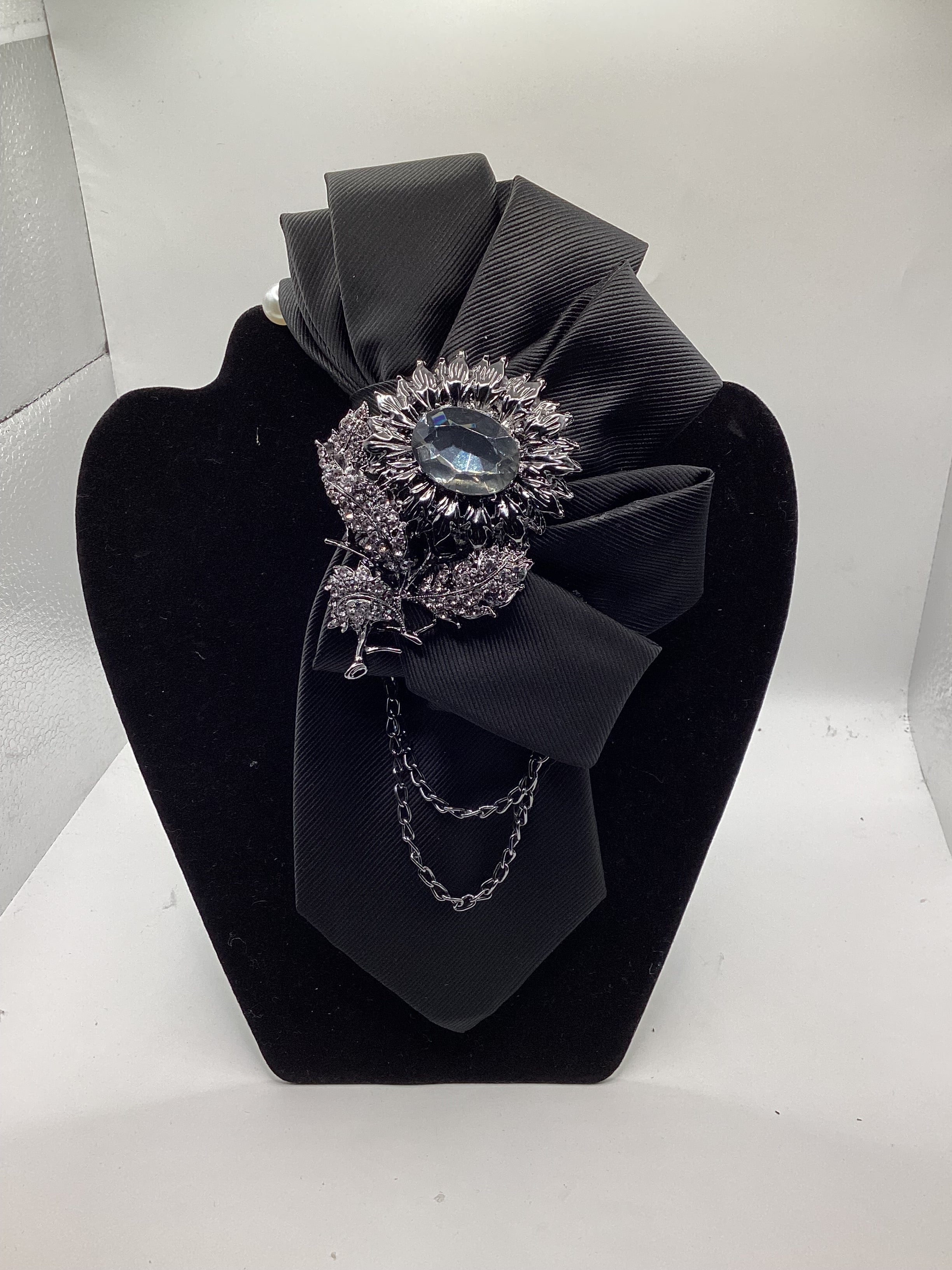 Midnight Elegance Statement Tie – Black Crystal Floral Brooch with Chain Accent